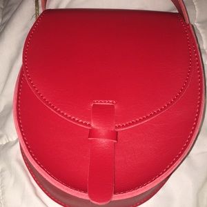 A red  new handbag from Brandy Melville.